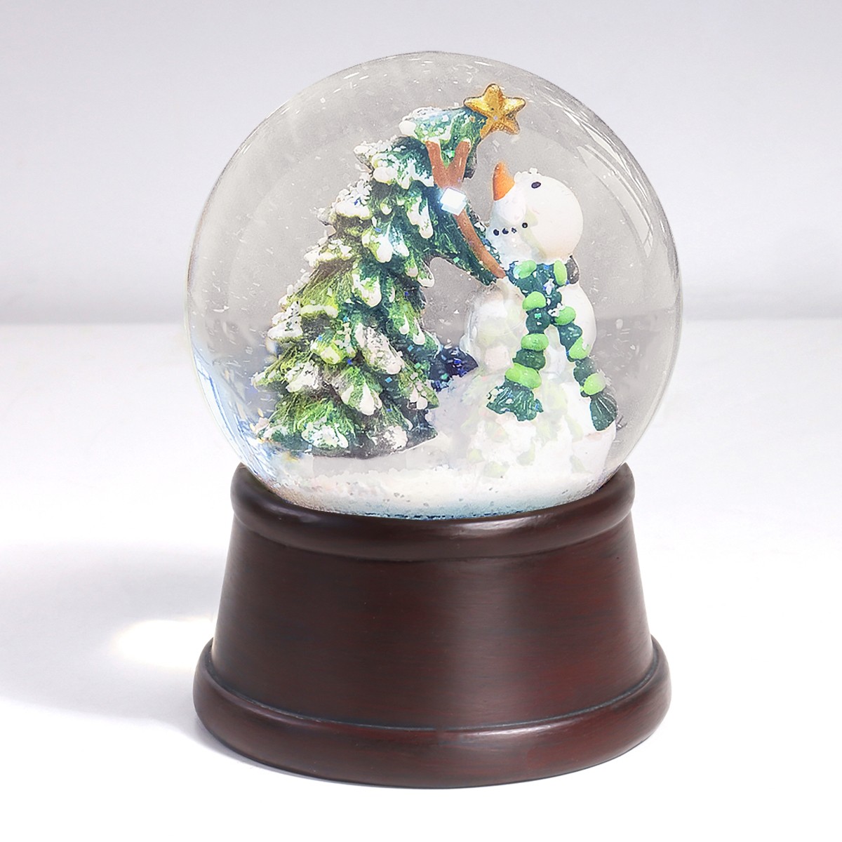 Снігова куля ялинка та сніговик